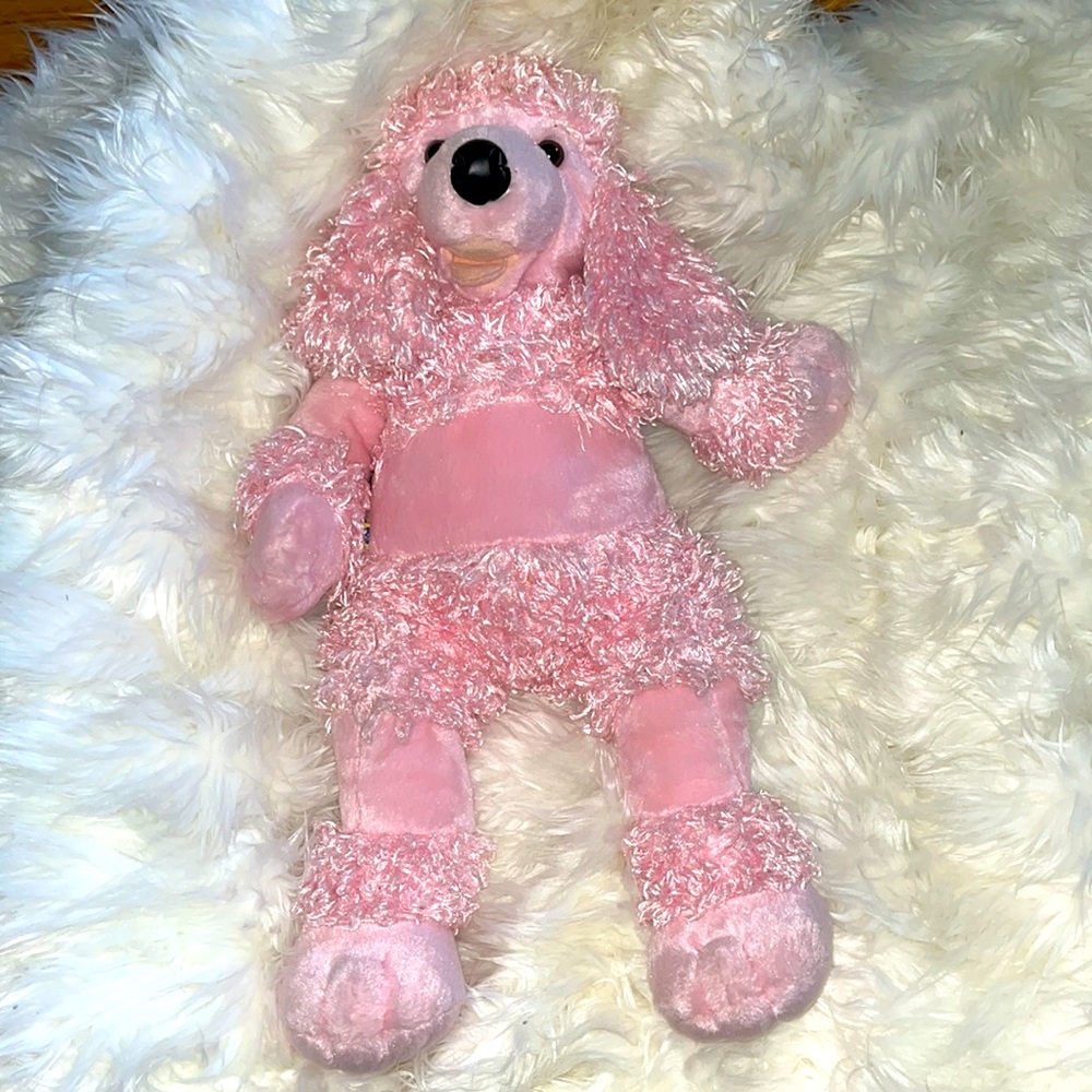 Build a bear pink poodle. Sings Happy Birthday.